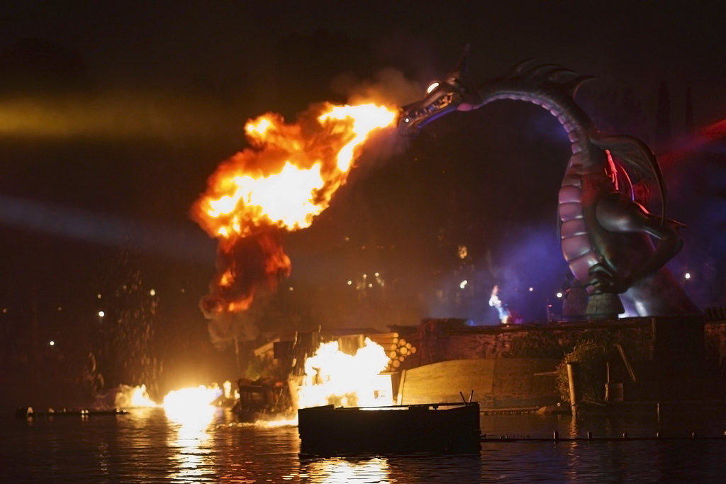 Fantasmic's fire breathing dragon on the Rivers of America